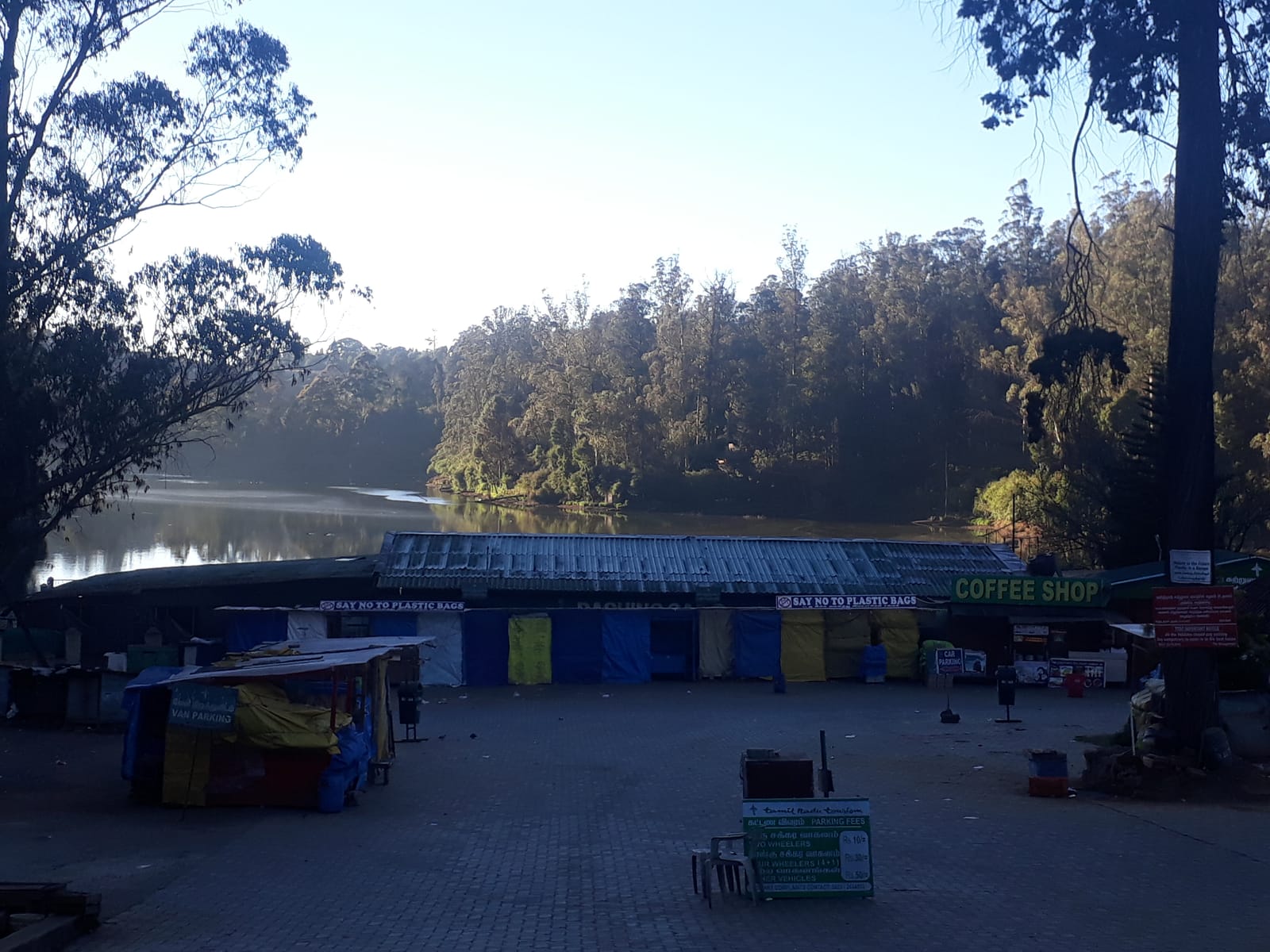 Rowing boats on Ooty Lake with the Nilgiri hills behind